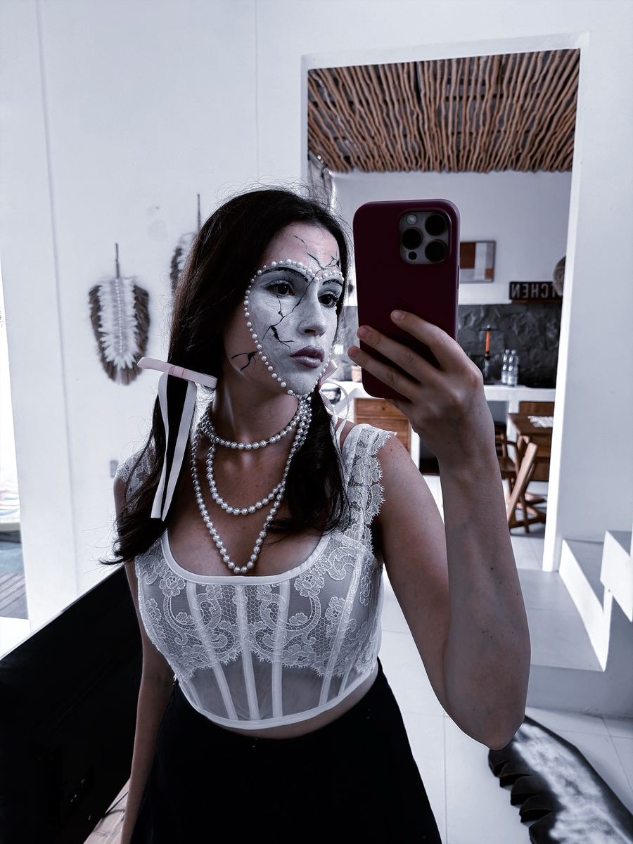 Cracked porcelain doll makeup in white and grey with pearl detailing
